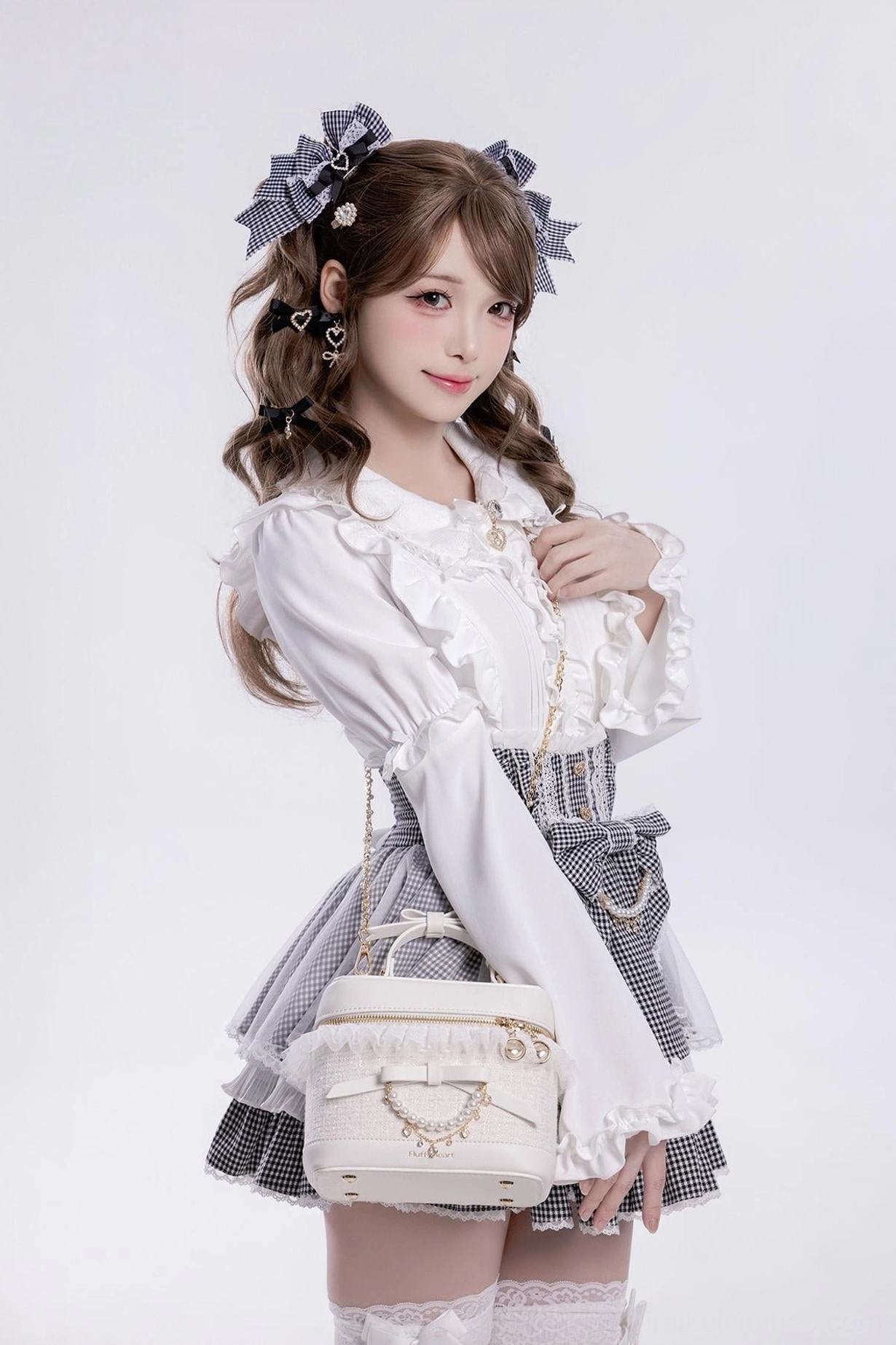 White lace Ryousangata bucket bag with bow handle front three-quarter view Jirai Kei lolita fashion styling
