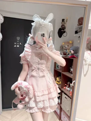 Pink gingham Ryousangata Jirai Kei maid dress and shorts set with lace ruffles and heart detail, mirror selfie