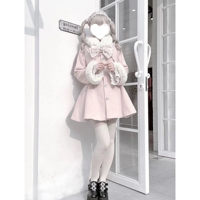 Full body side profile of pink Ryousangata Jirai Kei winter coat showcasing short flared A-line silhouette, black platform shoes, white sheer tights, white glass storefront setting