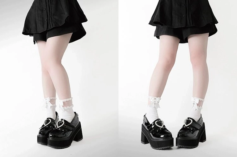 Low full-body side and rear view dual panel composition showing two models in black jirai kei mini skirts and white socks wearing heart buckle platform loafers with classic loafer silhouette and thick platform sole