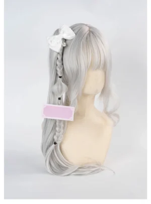 White lace-trimmed Ryousangata bow hair clip with silver crown pendant displayed on silver braided wig mannequin, side view showing delicate bow design and regal crown charm