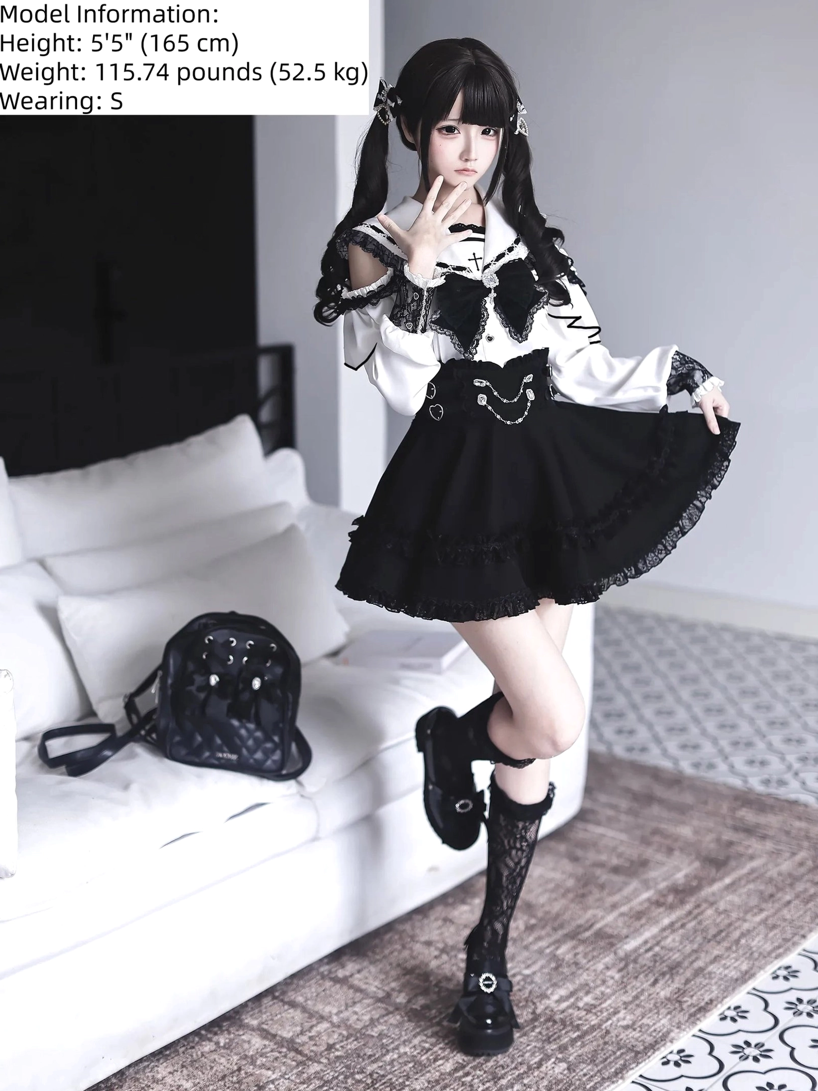 Jirai Kei two-piece sailor collar set dynamic pose with model on sofa, elevated leg showing matching lace socks and platform shoes