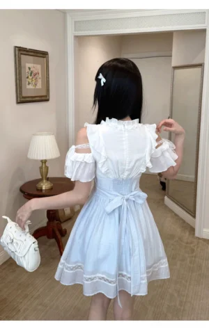 Seiso Kei short dress back view showcasing off-shoulder ruffled trim, waist bow detail, and lace hem trim