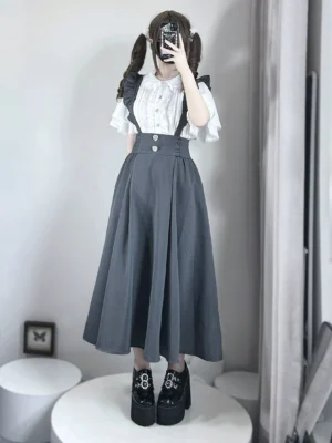 White seiso kei tiered ruffle blouse with gray overall skirt full front mirror selfie shot showing lace collar and pearl button details on twin-tailed lolita model