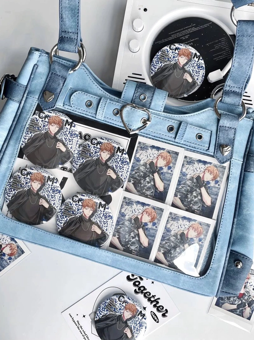 Sky blue Jirai Kei ita crossbody bag official product shot with transparent window and heart-shaped metal hardware prominently featured in presentation