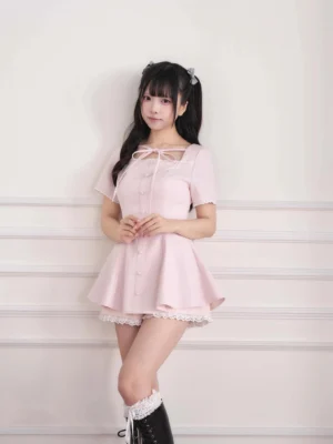 Soft pink lace trim ryousangata dress and elastic shorts set with hand-tied bow neckline, frilled lace hem, and elastic waist shorts on twin-tailed model, front full-body view jirai kei aesthetic