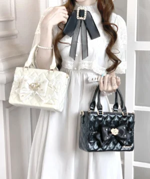 Square quilted handbags in cream and black colorways with lace bow and diamond quilting, styled with vintage Lolita outfit