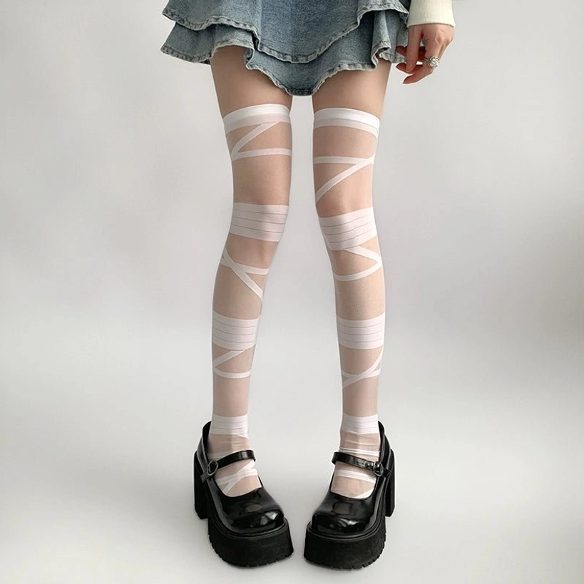 Strappy thigh-high sheer socks front straight leg view with neat white crisscross strap design and denim mini skirt platform Mary Jane styling