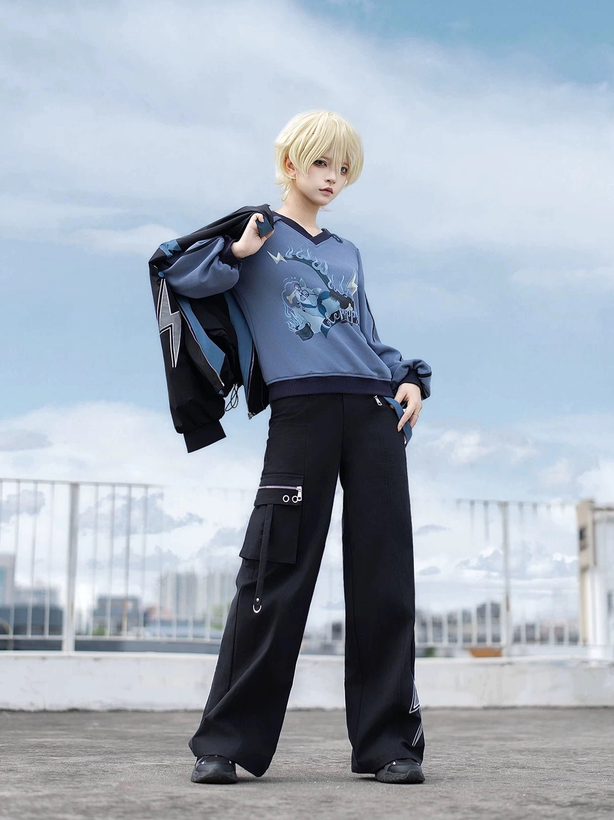 Side cargo pocket detail of Techwear Pants and Volt Cat sweatshirt with jacket worn over shoulder Jirai Kei street style