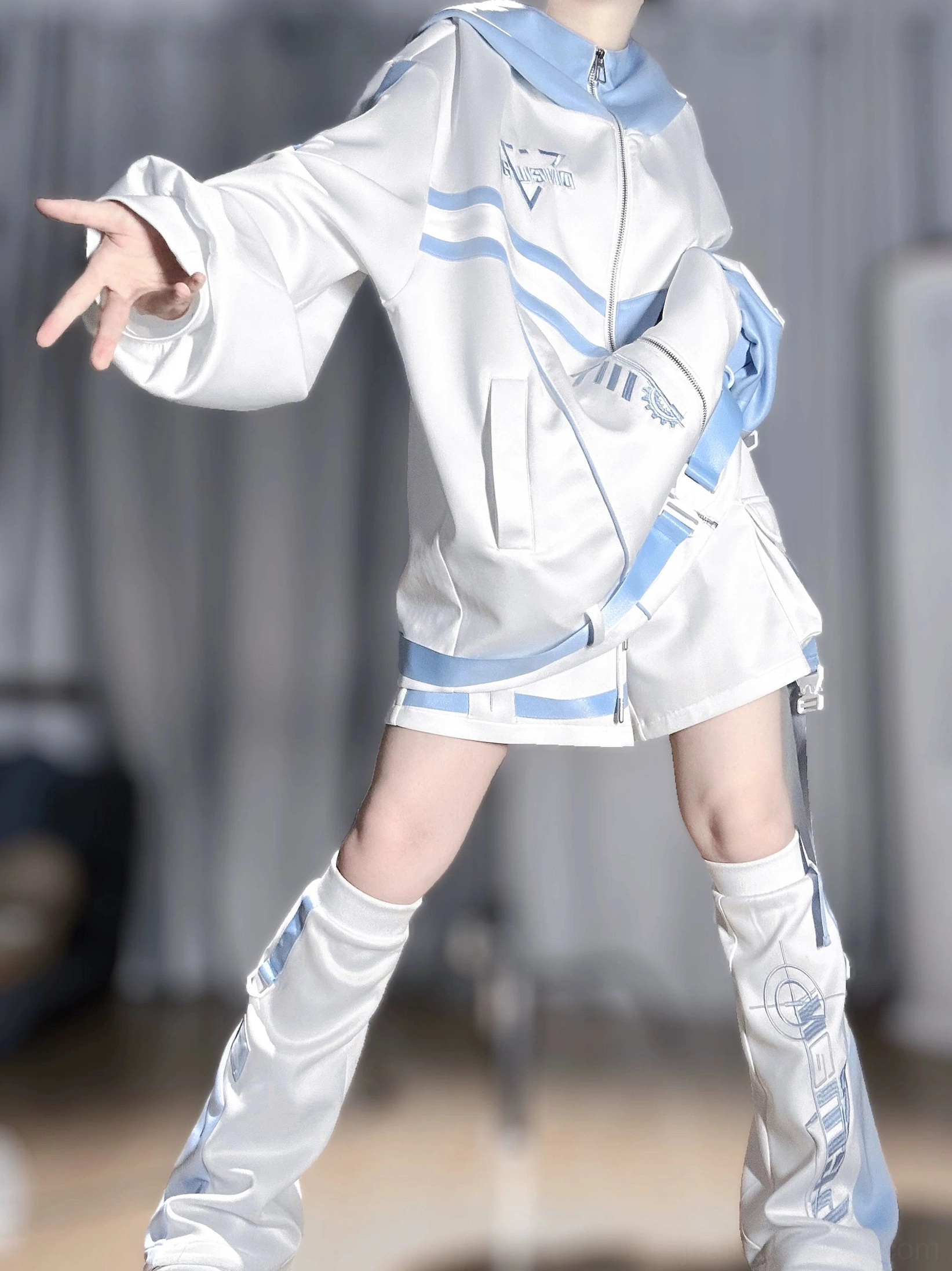 Techwear hoodie and shorts set front wide stance view featuring front zip design, waist blue border accent, printed leg warmers, and complete outfit coordination