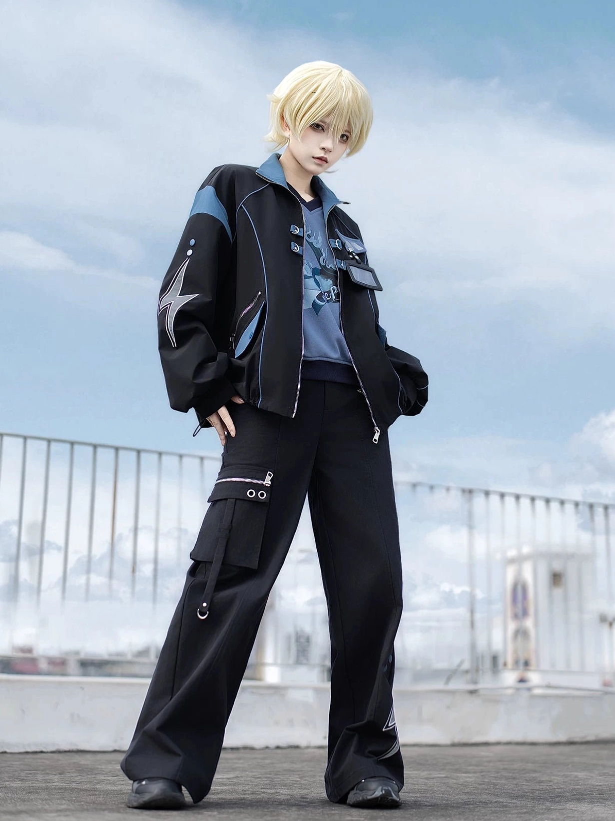 Dual side pockets and zipper closure detail of Techwear Jacket with blue accent stitching on black base color