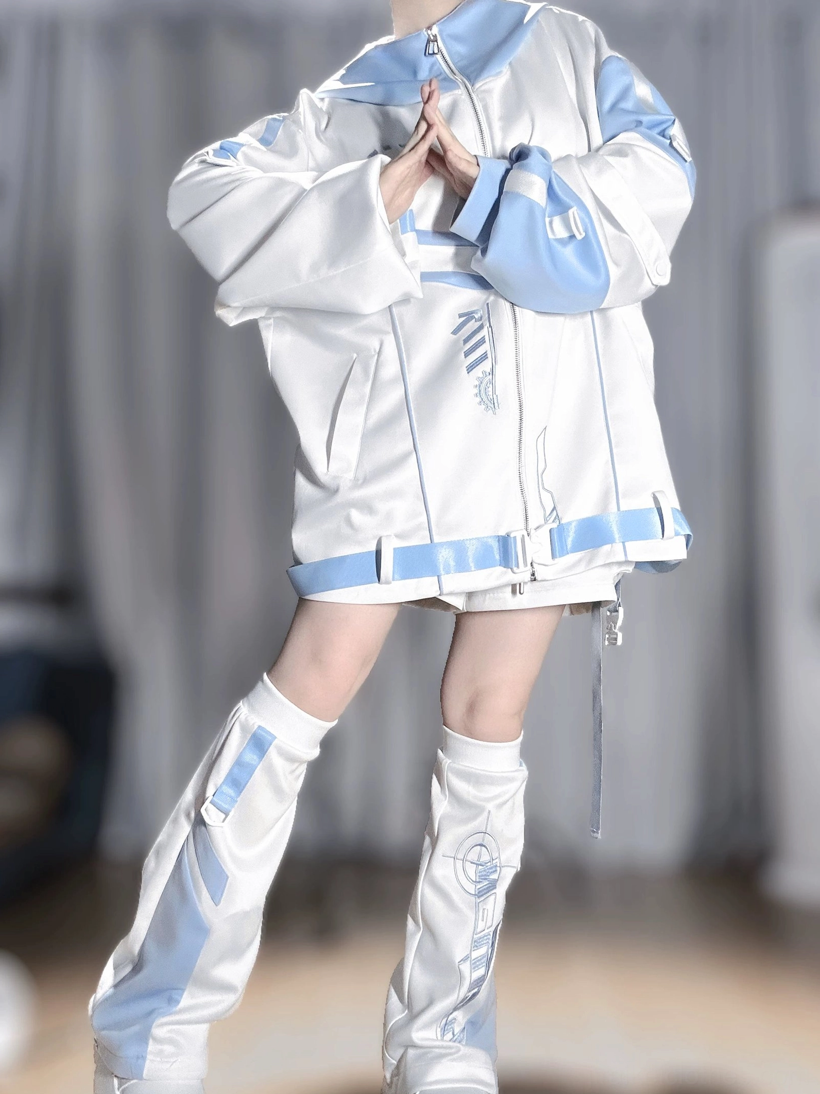 Techwear leg warmers size M and L standalone product view showing graduated opening circumference, blue accent trim, and authentic Y2K aesthetic detail