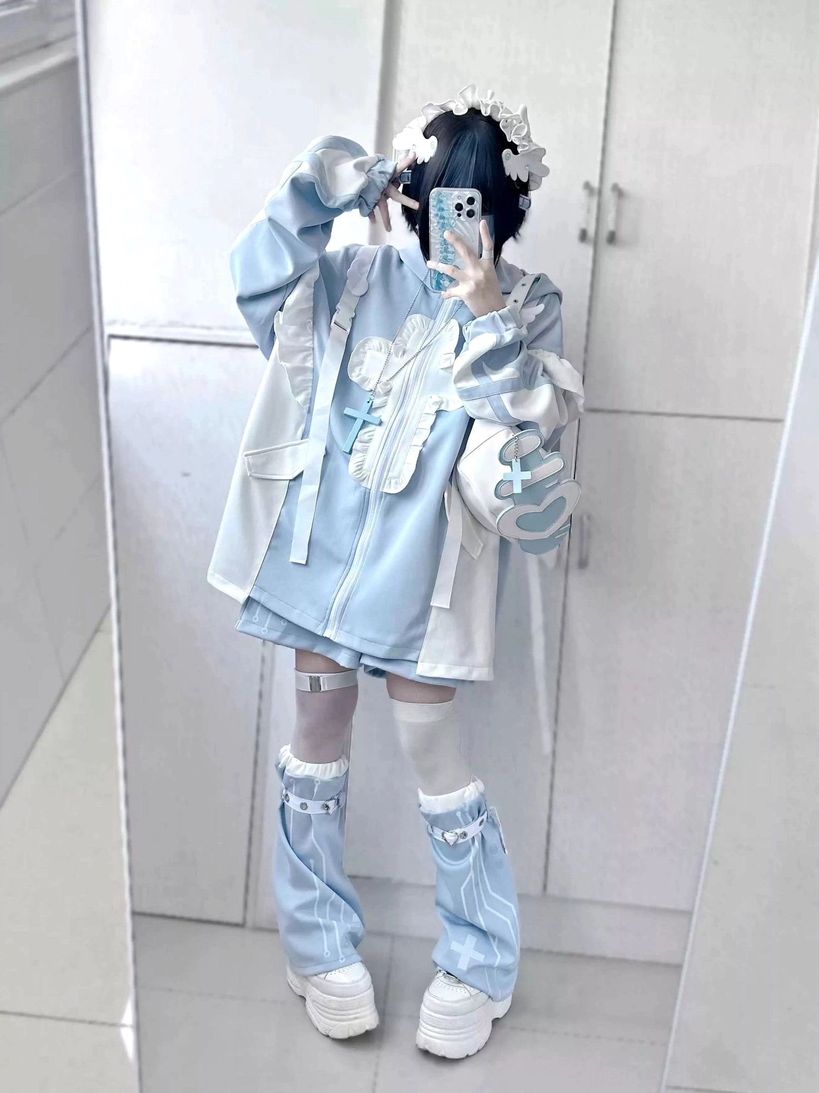 Side-front mirror selfie of blue-white tenshi coat set featuring cross bag accessory, flounce details on arms and chest, light blue leg warmers and white platforms