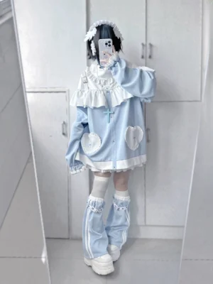 Back view of Tenshi Jirai Kei oversized hoodie featuring ruffled back trim, heart patches, and cross details with coordinating leg warmers and platform shoes