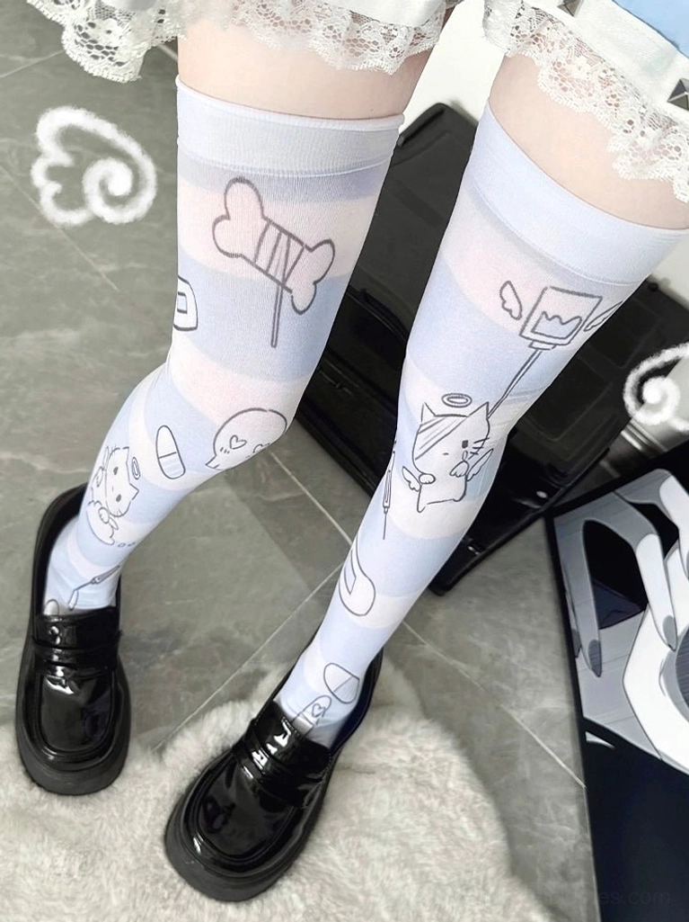 Tenshi Kaiwai angel over-the-knee velvet socks with pale blue cartoon prints and lace trim worn with black loafers, low overhead eye-level view showcasing Jirai Kei style