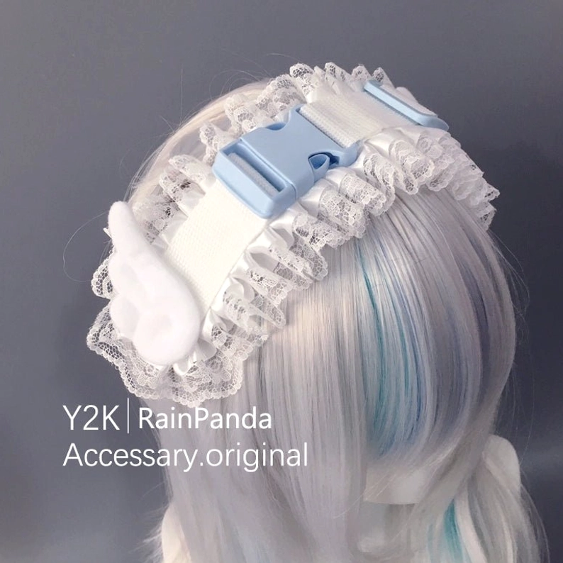 Tenshi Kaiwai angel wings headband left rear angle view light blue plastic buckle white angel wing embellishment ethereal Tenshi aesthetic accessory