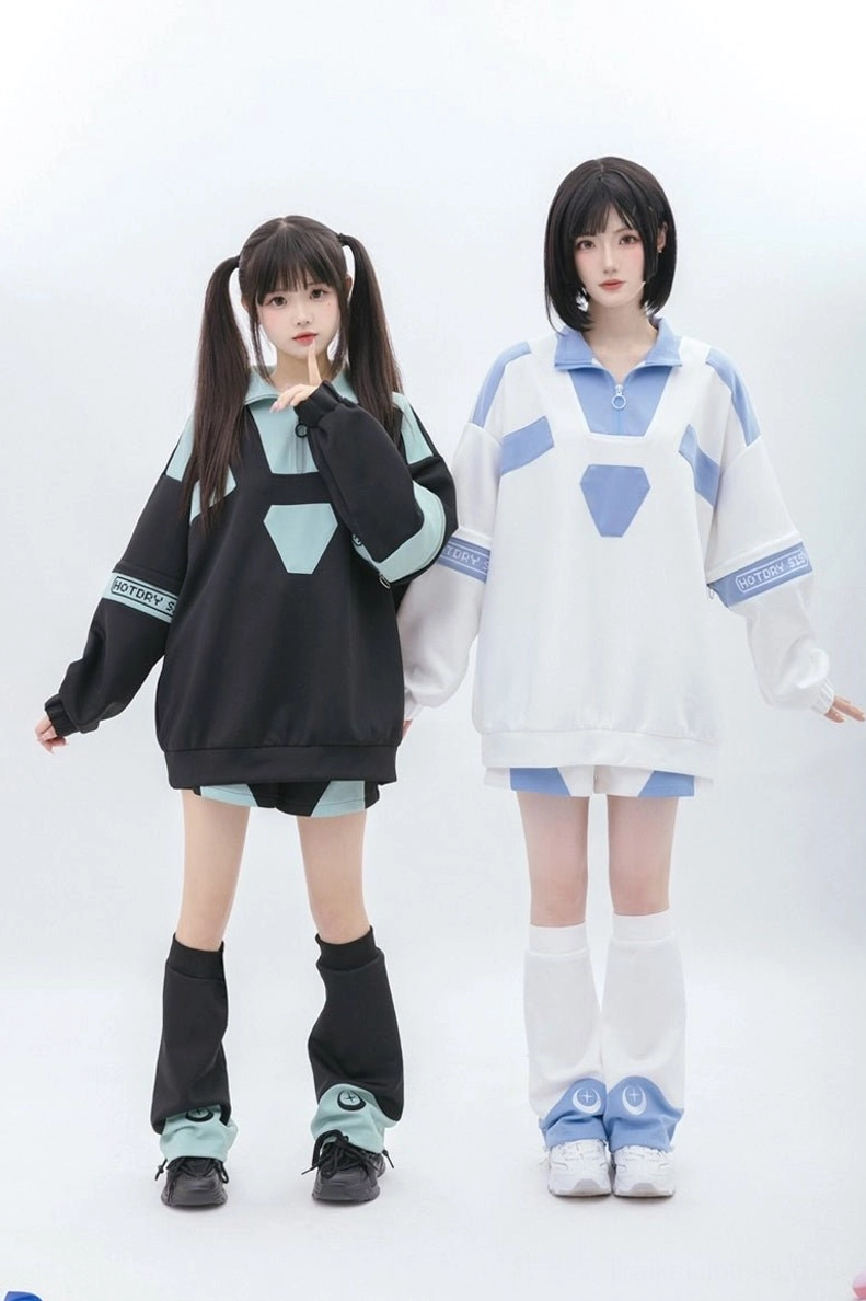 Full-body front standing view of bicolor Tenshi Kaiwai sweatshirt set with two female models, one hand near face showcasing consistent color coordination