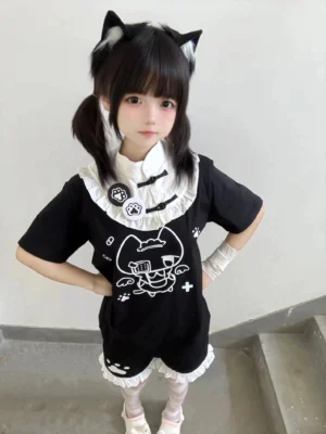 Black Tenshi Kaiwai cat ear themed cotton T-shirt with white ruffled stand collar and paw badges front standing view staircase