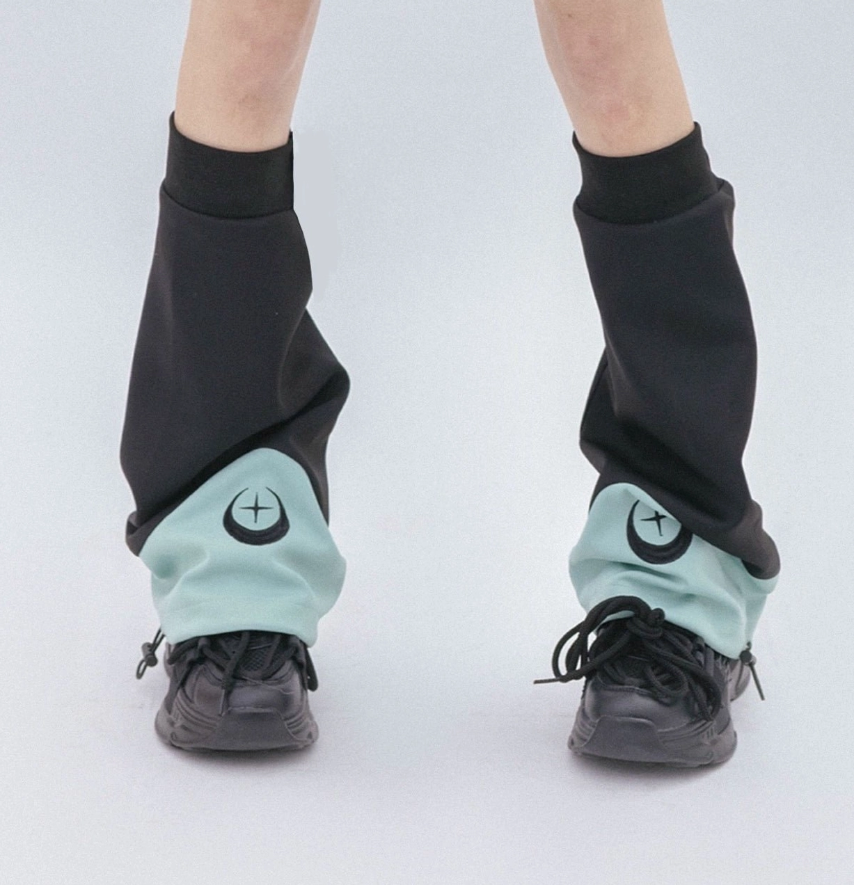 Black and green Tenshi Kaiwai leg warmers only option with crescent star hem embellishment and elastic calf design for gaming aesthetic