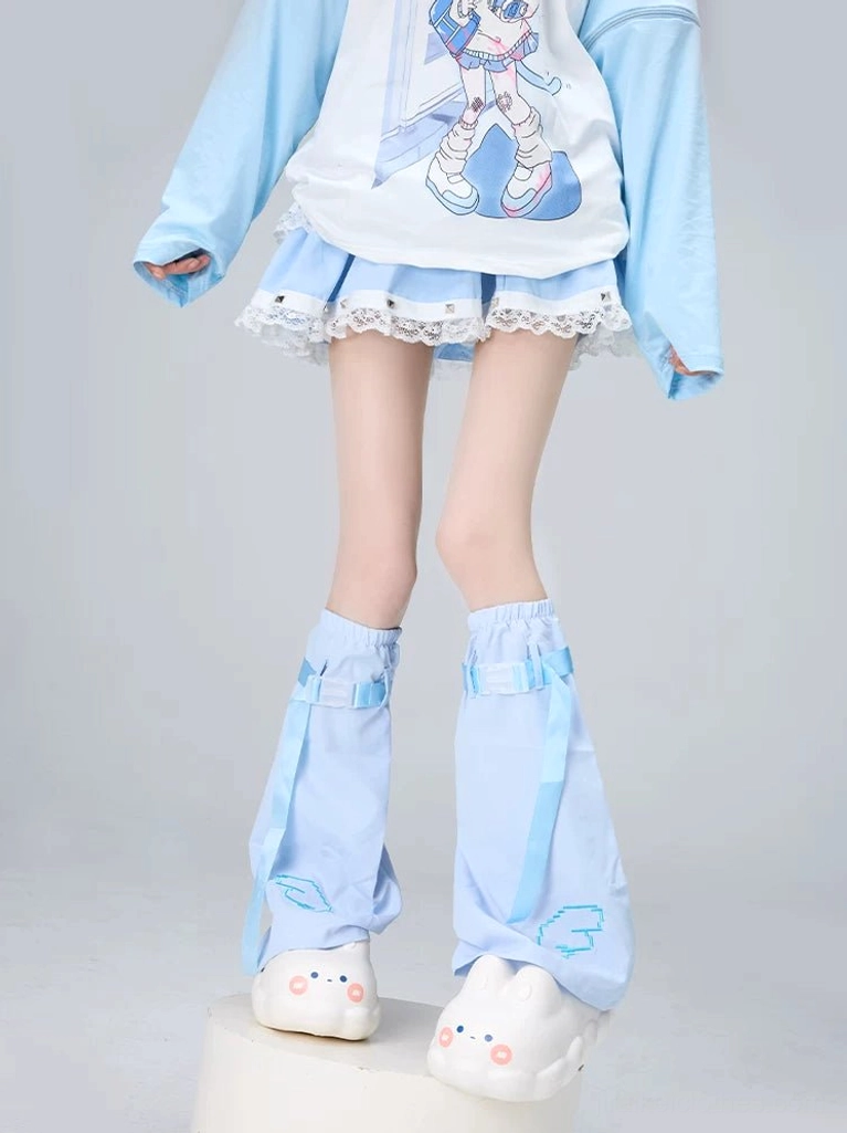 Light blue Tenshi Kaiwai flared leg warmers with cloud embroidery and blue ribbon straps, showcasing celestial aesthetic on female model studio background