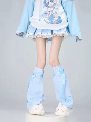 Light blue leg warmers featuring pixel cloud embroidery design and adjustable fasteners styled with anime graphic top and ruffle skirt full body view