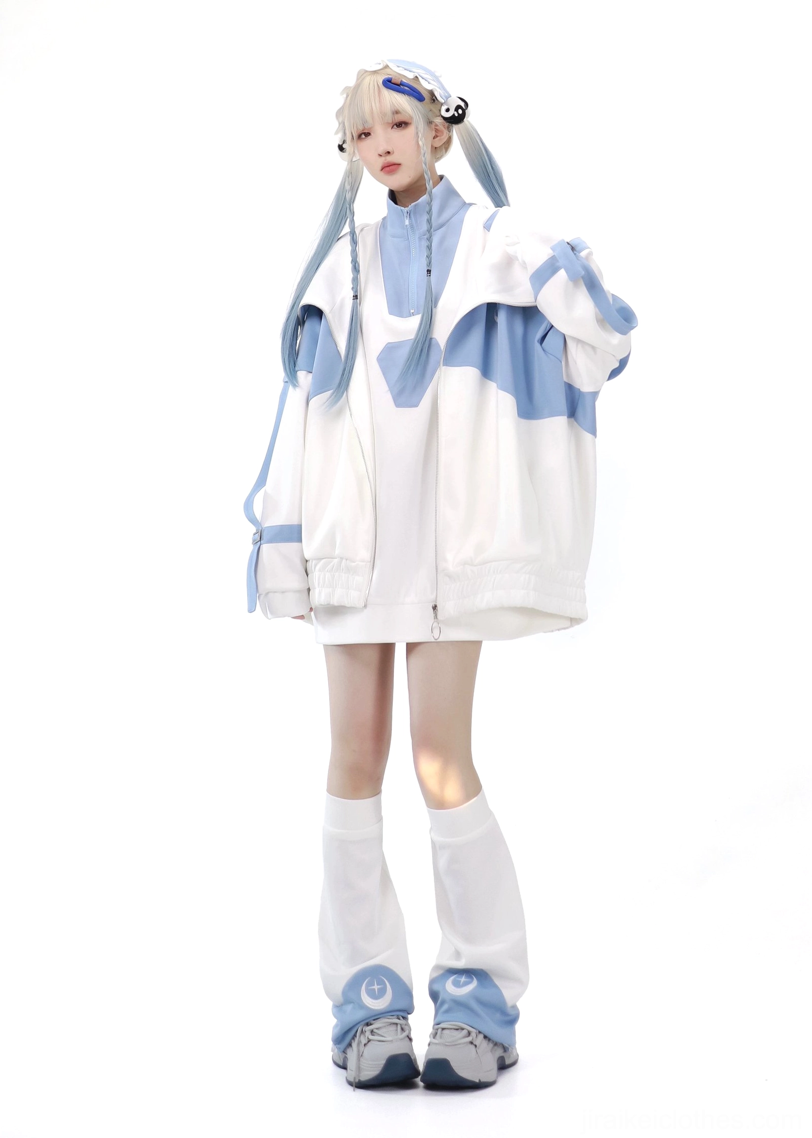 Blue-white Tenshi Kaiwai color-block sports set with oversized zip hoodie and straight crescent leg warmers on blonde model full-body front view in white studio