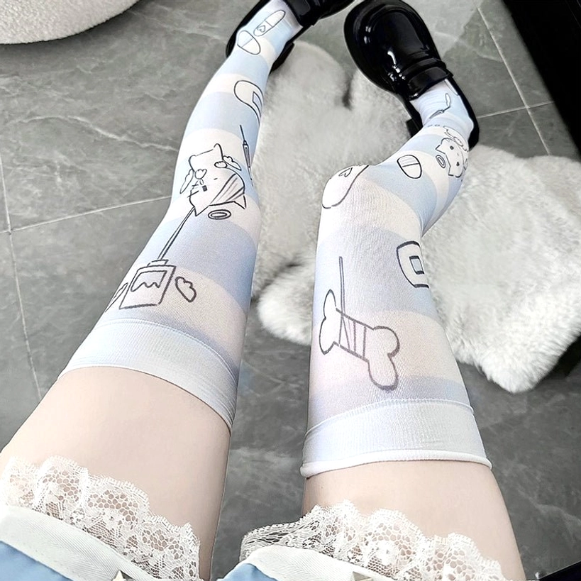 Cartoon angel over-the-knee socks with wide lace thigh band and light blue printed cartoon patterns, side view on female legs wearing black loafers