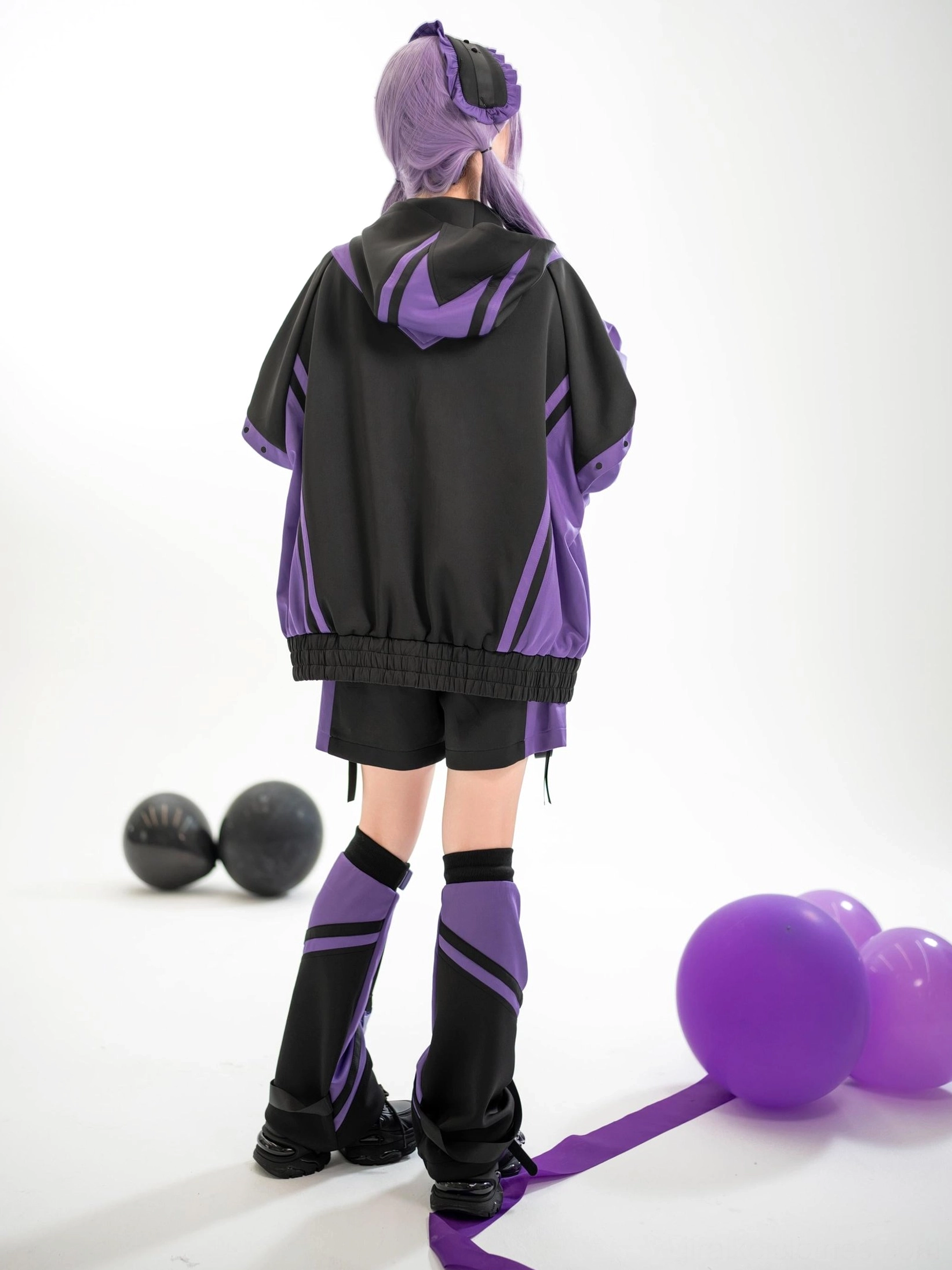 Tenshi Kaiwai color-block hooded jacket back view showing stripe details and structured fit