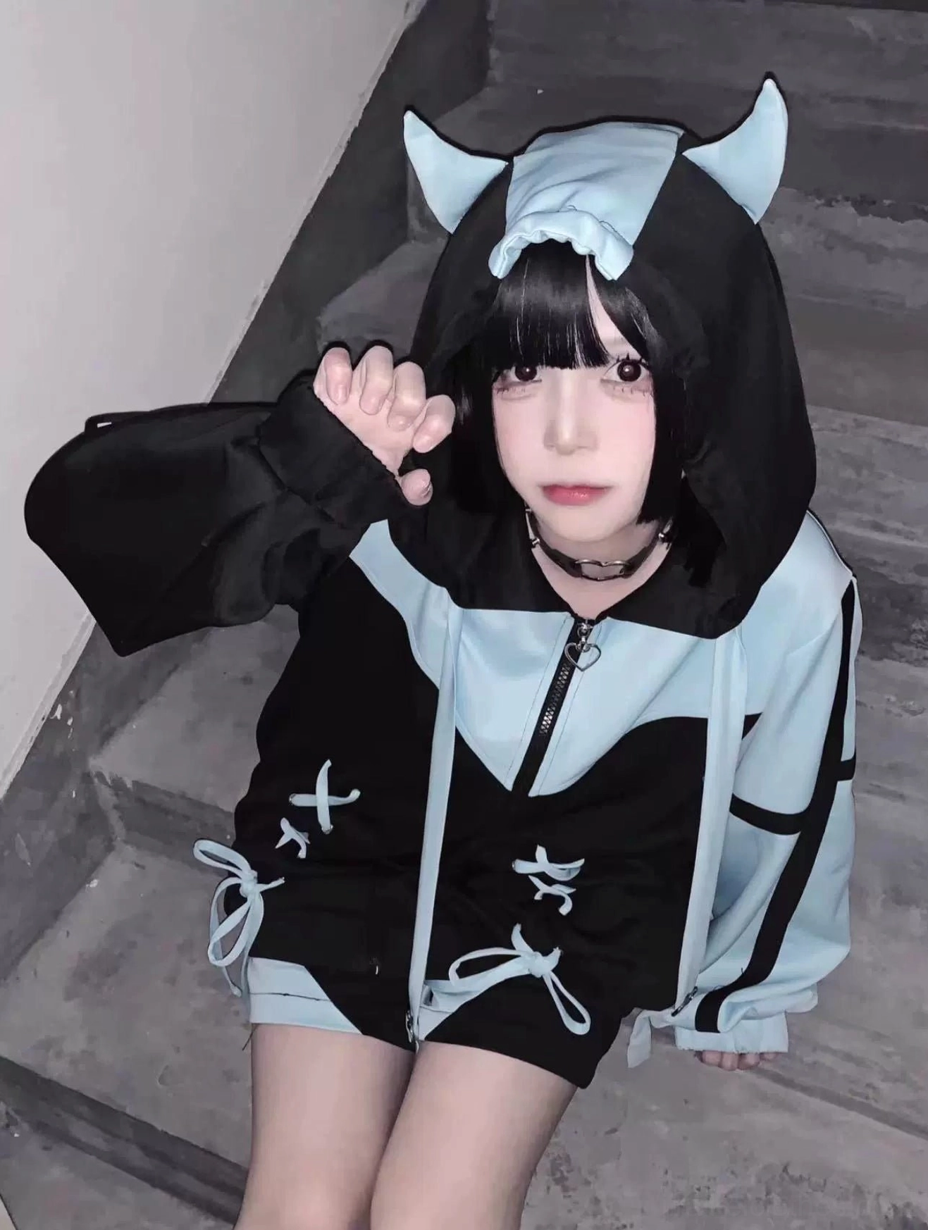 Tenshi Kaiwai Jirai Kei hooded jacket detailed front view showing symmetrical cross-lacing, color-block design, wide drawstring, and hood structure