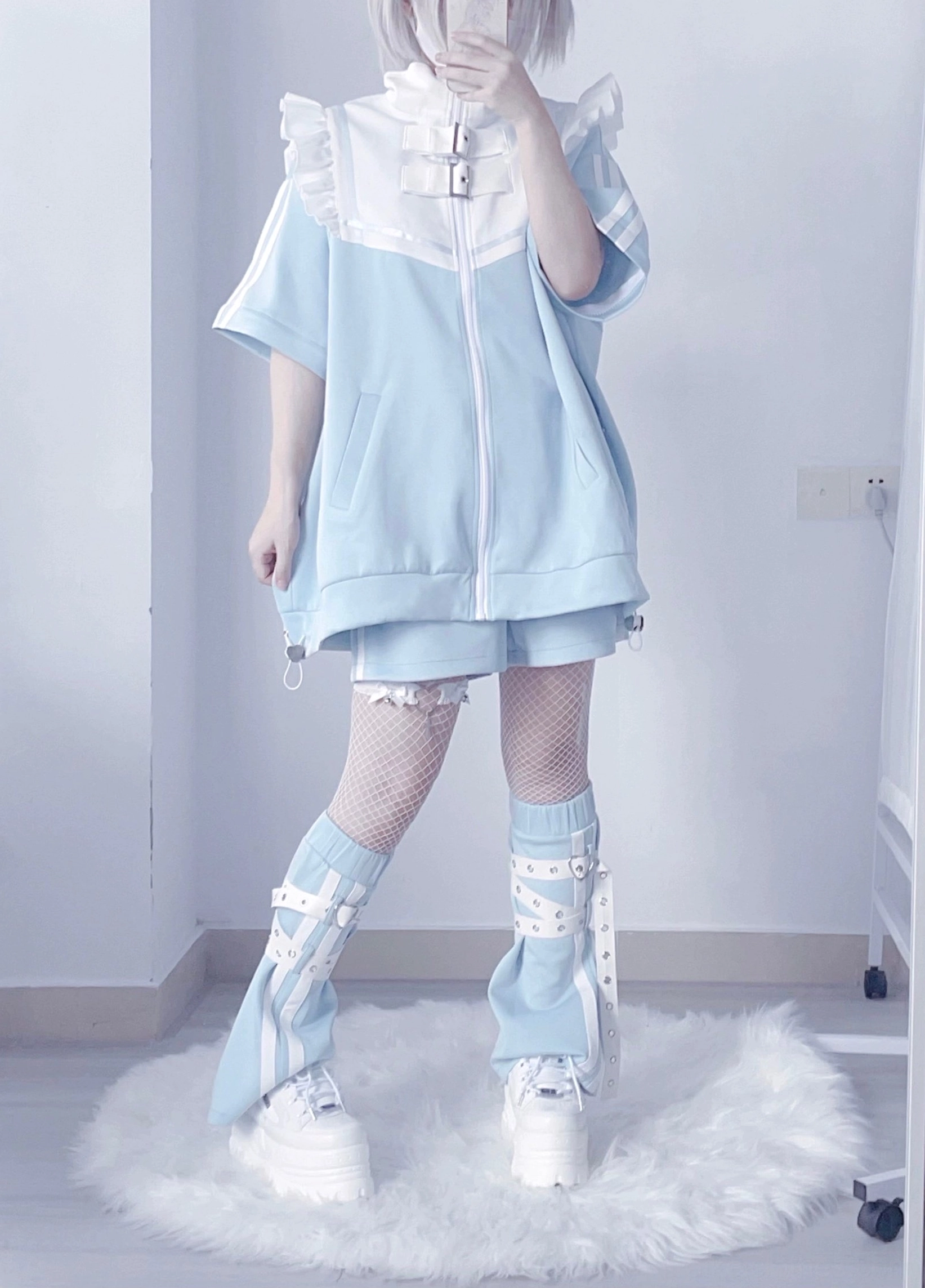 Tenshi Kaiwai detachable sleeve Y2K jacket with removable angel wings full-body front view model wearing light blue white oversized jacket fishnet stockings