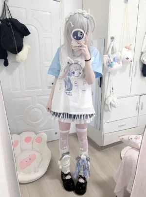 Tenshi Kaiwai light blue raglan anime shirt full body mirror selfie with white body striped pleated skirt bedroom styling Jirai Kei subculture fashion
