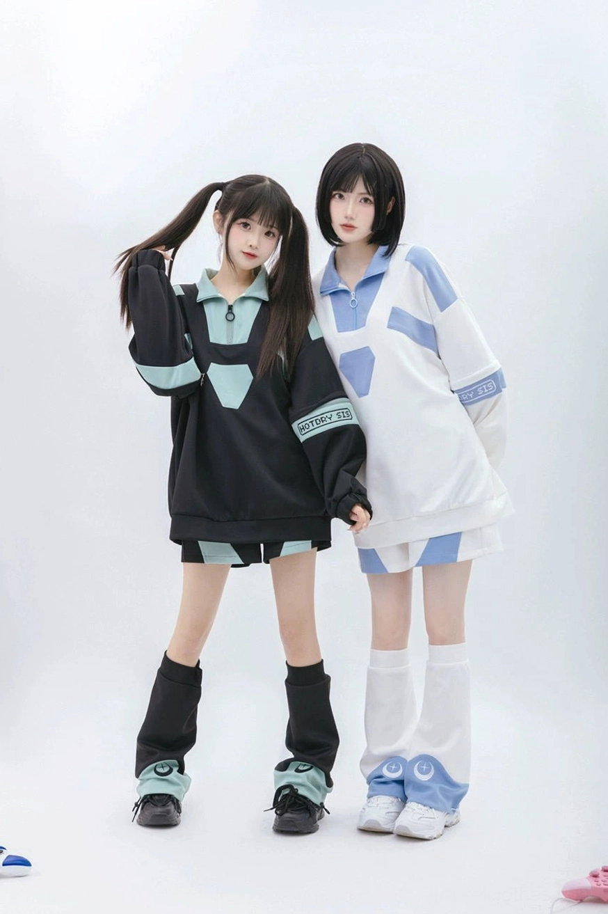 Full-body slight angle view of matching Tenshi Kaiwai loungewear set with leg warmers featuring blue crescent moon celestial patterns at hem