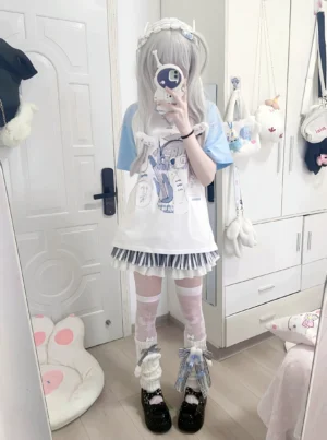 Tenshi Kaiwai light blue raglan anime shirt front mirror selfie long silver hair subculture girl with anime graphic guitar player black striped skirt