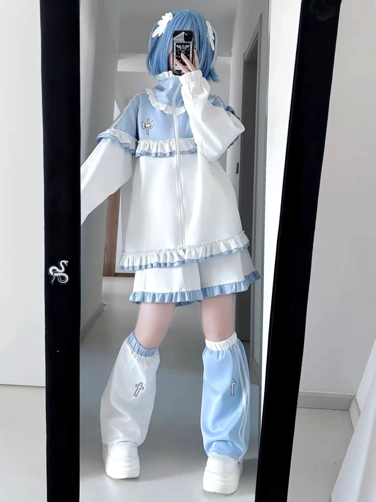 Sky Blue Tenshi Kaiwai tracksuit detail showing frill trim, color-blocking panels, embroidered chest design and seam construction