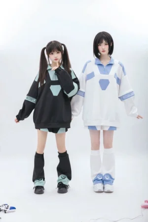 Tenshi Kaiwai removable sleeve sweatshirt and shorts set worn by two female models in full-body front standing view, showcasing both blue and white and black and green color options with geometric trim details