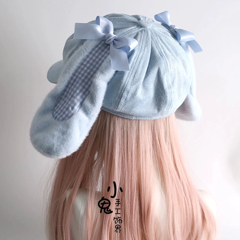 Baby blue Tenshi Kawaii bunny ear newsboy cap back view on pink wig mannequin showing satin bows and gingham lined ears