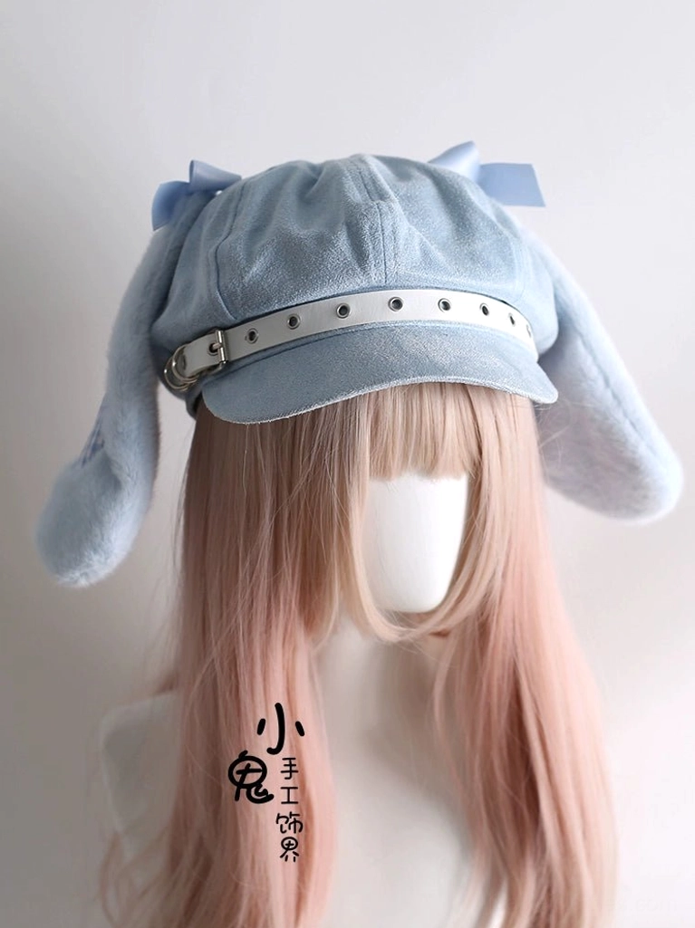 Baby blue Tenshi Kawaii bunny ear newsboy cap front view on pink wig mannequin with leather buckle brim strap bilateral ears