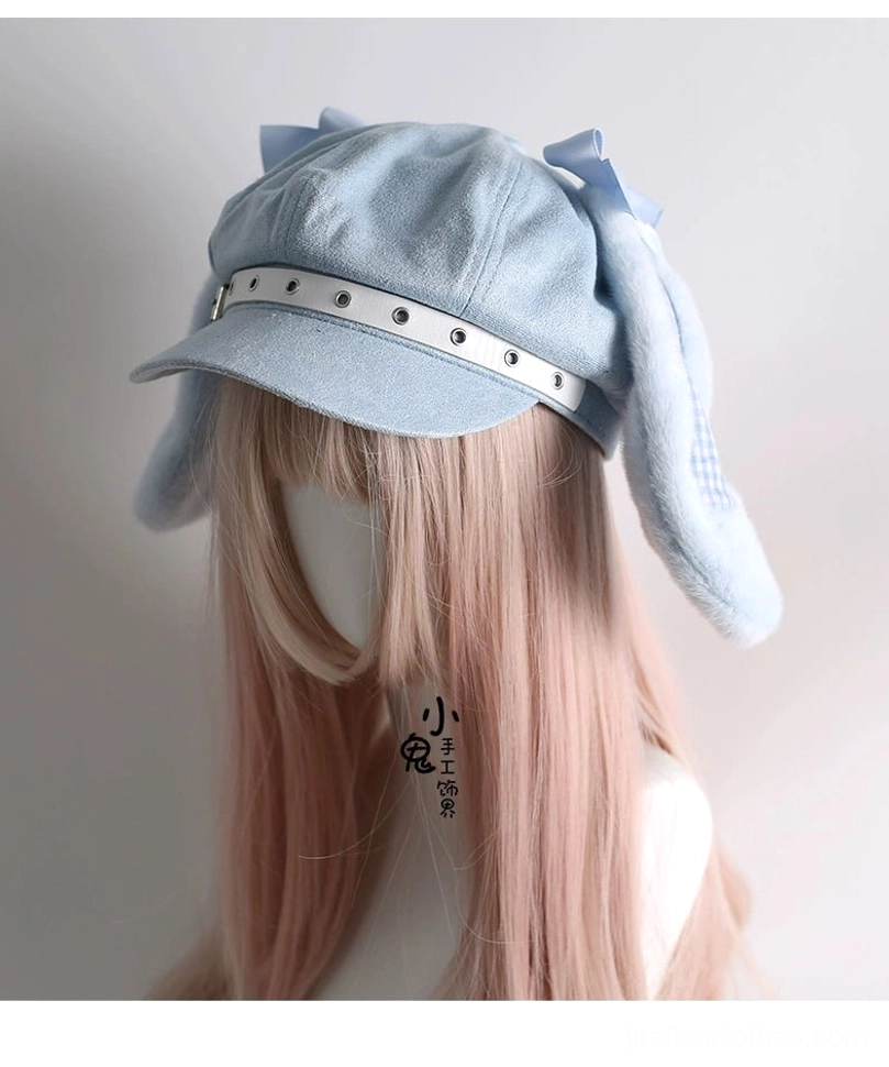 Baby blue Tenshi Kawaii bunny ear newsboy cap side three-quarter view on pink mannequin single side bow leather strap detail