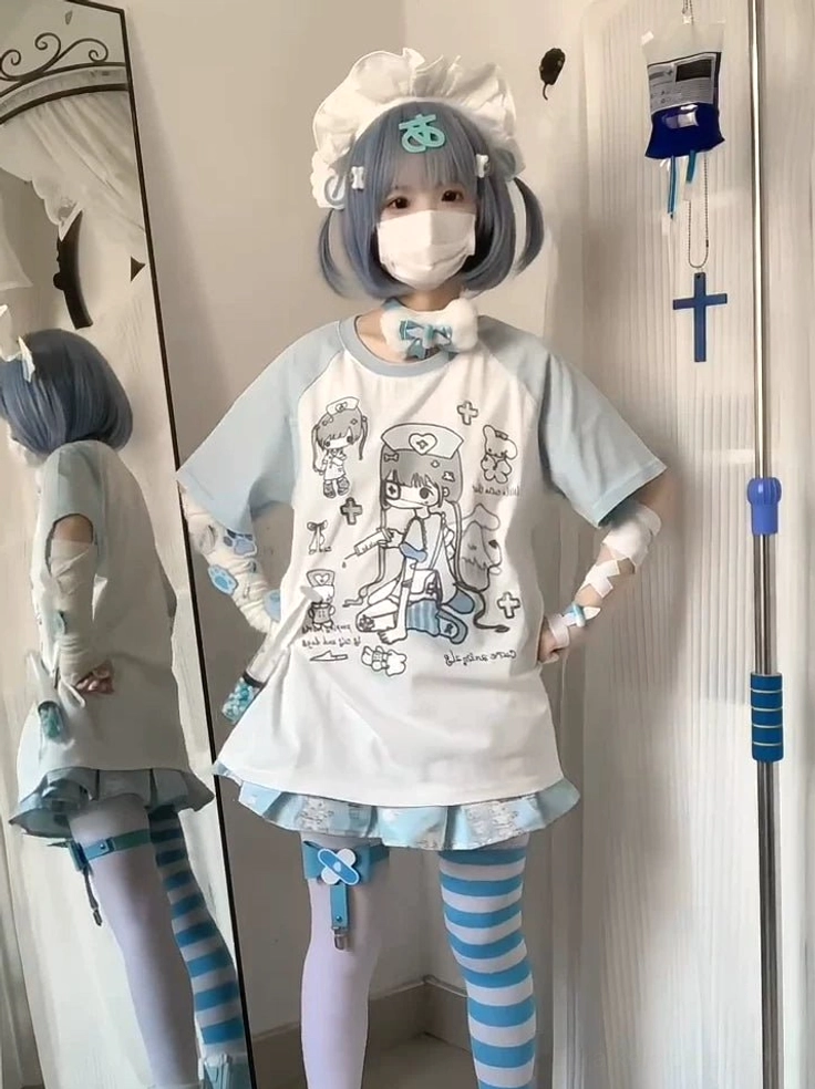 Raglan sleeve trim and accessory details including light blue sleeve cuff and cartoon print graphics on anime streetwear tee