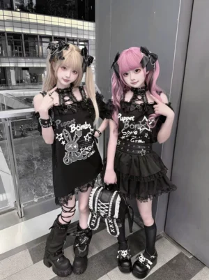 Twin gothic punk models wearing matching halter bunny print jirai kei t-shirts with tiered star skirts outdoors at shopping mall terrace
