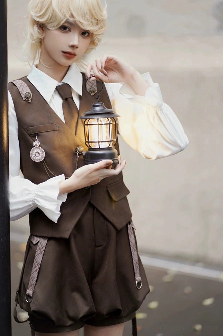 Close-up waist-up front view of vintage Detective Ouji Lolita vest set, showcasing tailored brown serge vest with pocket watch chain detail, formal necktie, and decorative patches on blonde model