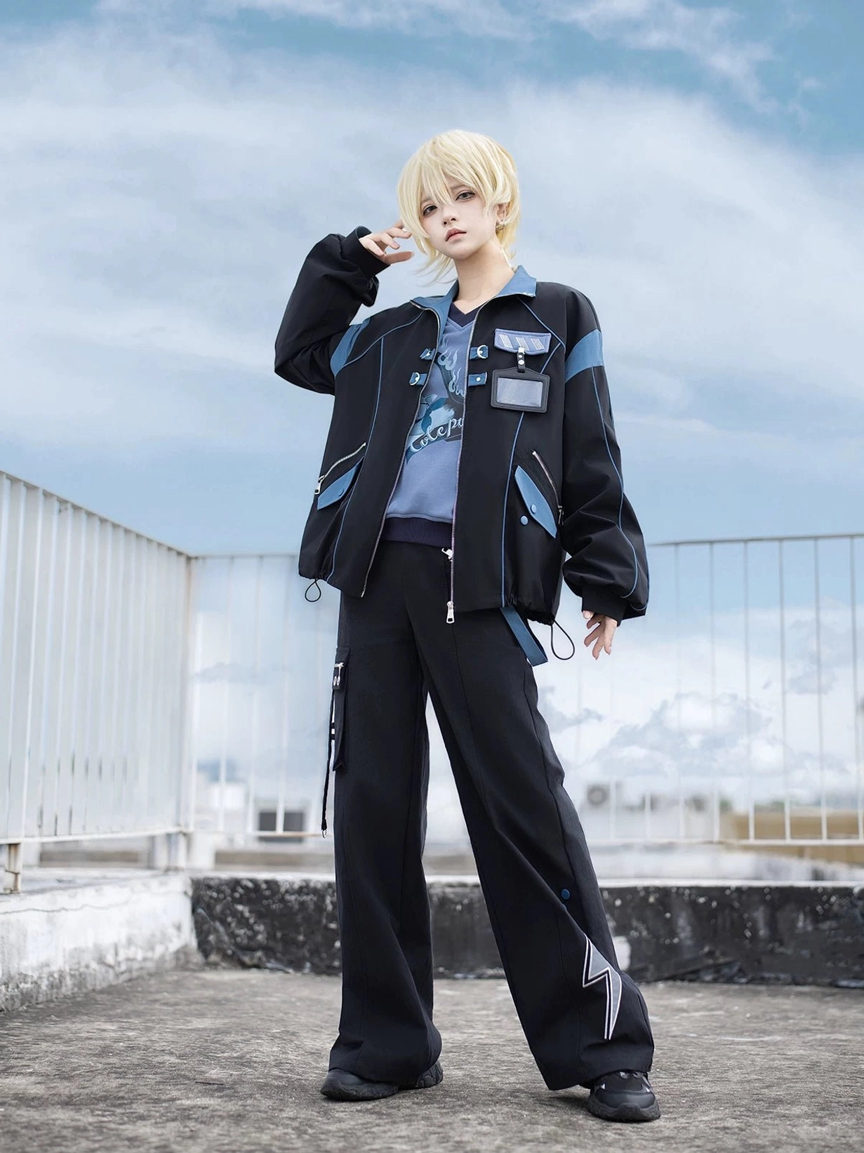 Volt Cat Lightning Techwear Cargo Jacket and Pants Set front full-body view with model wearing black and blue Jirai Kei streetwear ensemble on rooftop