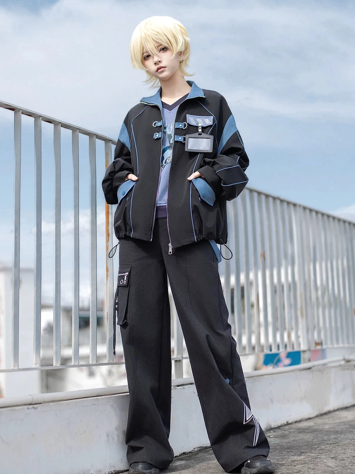 3/4 angle view of Volt Cat Lightning Techwear Set with model showcasing hands in jacket pockets and tactical chest details