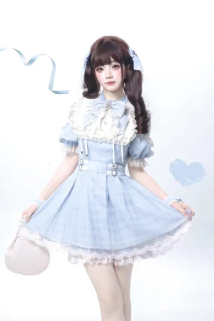 Water blue Jirai Kei lolita dress front three-quarter view with white lace trims puff short sleeves box pleat skirt rhinestone buckle accents and detachable satin bow tie