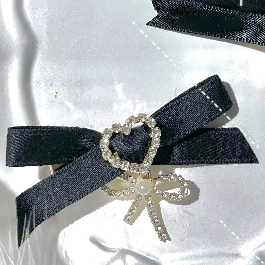 Water blue swallowtail bow hair clips Jirai Kei style with ornate rhinestone center and decorative heart pendant accent