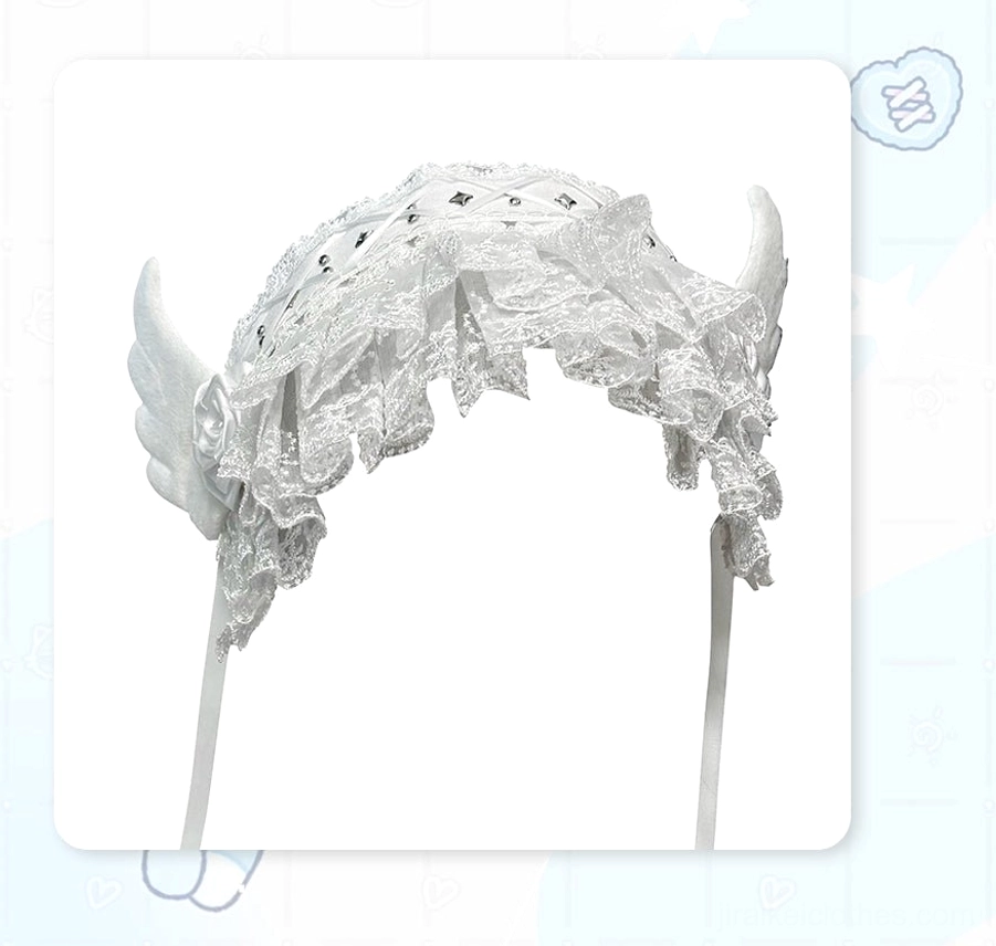 White angel wing lace Jirai Kei hairband flat front product shot displaying ruffled lace dual angel wings rose accent and tie straps against cute cartoon background