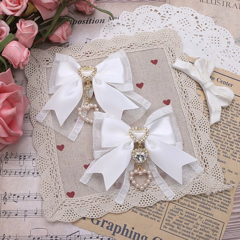 White bow hair clip with heart-shaped rhinestone charm and pearl details - pure aesthetic Jirai Kei style