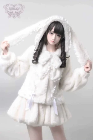 White fuzzy bunny ear hooded Jirai Kei winter coat set with lace-trimmed bow collar and matching plush mini skirt front three-quarter view on model