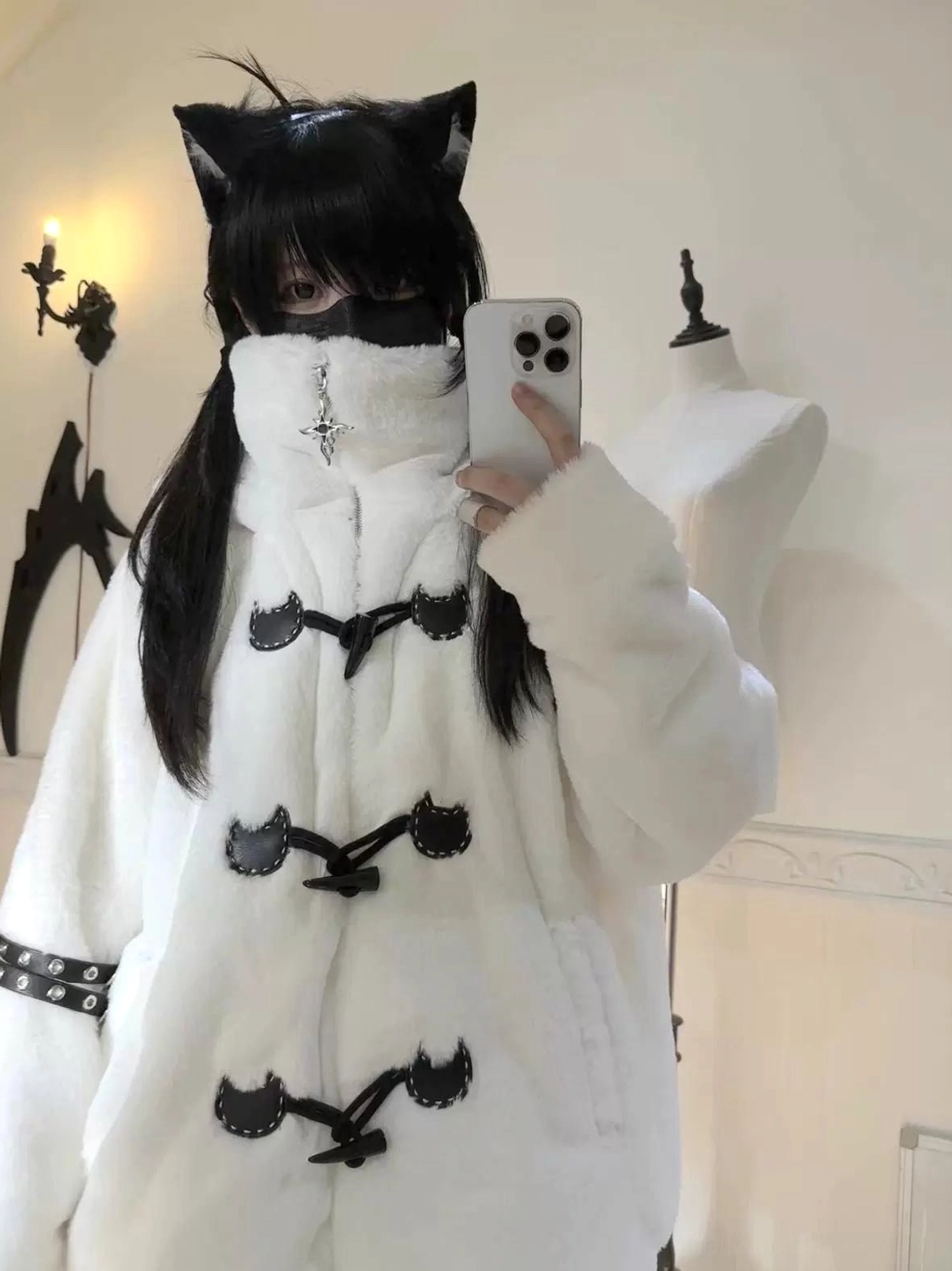 White plush cat ear hooded fuzzy coat selfie front view black-haired girl indoor vintage room aesthetic cross pendant
