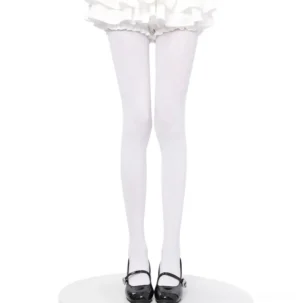 White elastic pantyhose matte finish front view on model wearing ruffled white skirt and black Mary Jane shoes, seamless leg coverage